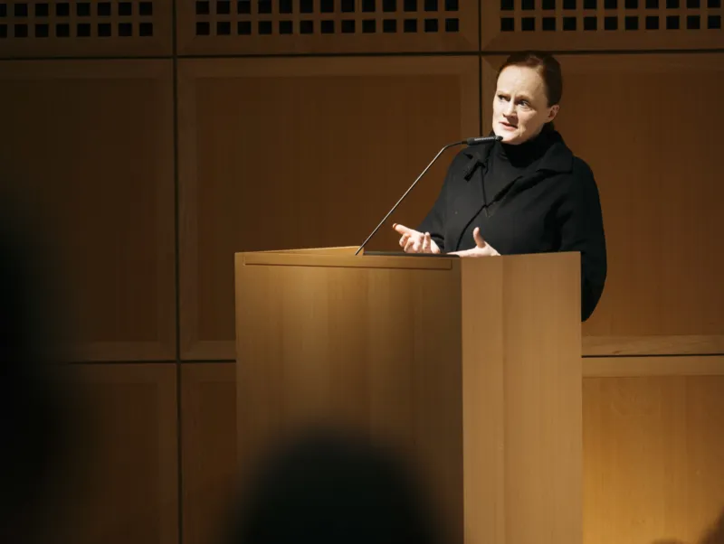 Bettina Steinbrügge speaking at a lectern in the Mudam auditorium during the symposium “What Looks Good Today May Not Look Good Tomorrow: The Legacy of Michel Majerus” on 9 November 2022.