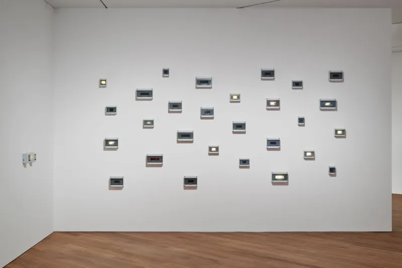 Joyce Joumaa, Periodic Sights (2025), time-based installation, inkjet prints on vellum paper, electrical enclosures, electronic timers and LED lights, dimensions variable. On view in Video Killed the Radio Star: The 1980s and their Cultural Echoes at Mudam Luxembourg (12 June – 11 October 2026). Mudam Luxembourg Collection. Donation 2025 – Baloise.
