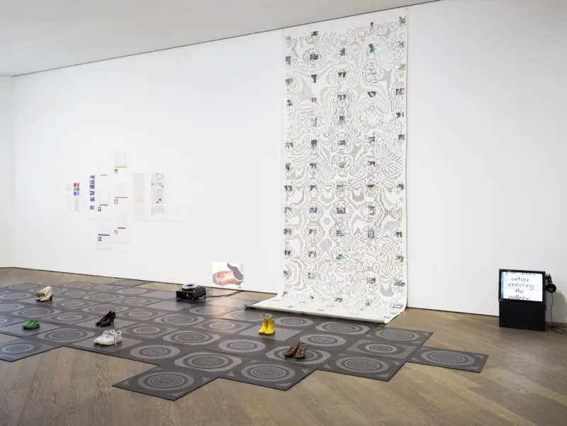 Sonya Rapoport, ‘Shoe-Field Map’, 1989. Digital print on vinylised paper with translucent colour printed acetate collage. ‘Shoe-Field Printouts’, 1986. Dot matrix print, collage, colour photocopy on acetate, paper, cellophane, coloured typewriter and graphite on continuous feed computer printout paper and vellum. 7 folios. ‘Shoe-Field Slides’, 1986/2024. Set of 61 slides. Exhibition copies. ‘Shoe-Field Tiles’, 1986/2024. Reproduction of a set of 91 tiles including  ve ‘shoe-psyche’ designs. Printed vinyl floor. Courtesy of the Estate of Sonya Rapoport. View of the exhibition ‘Radical Software: Women, Art & Computing 1960–1991’, Mudam Luxembourg. Photo: Mareike Tocha © Mudam Luxembourg