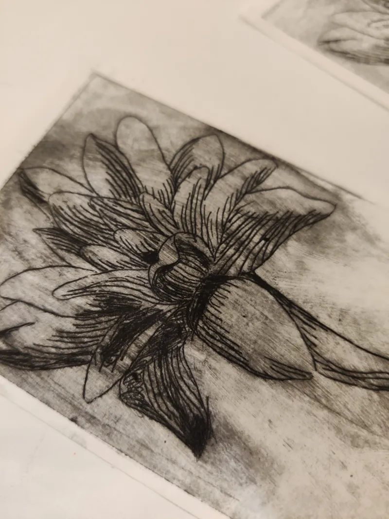 Black and white print of a flower.