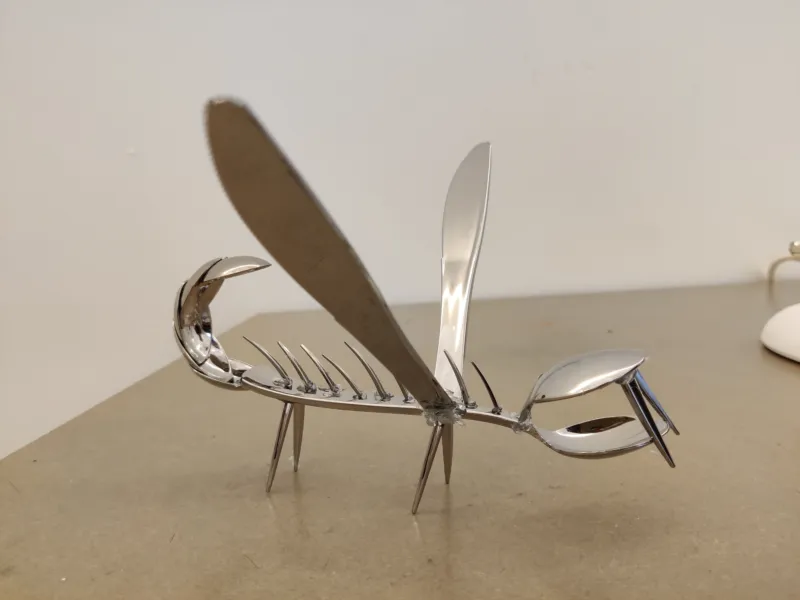 A sculpture made out of a fork in a Mudamini workshop