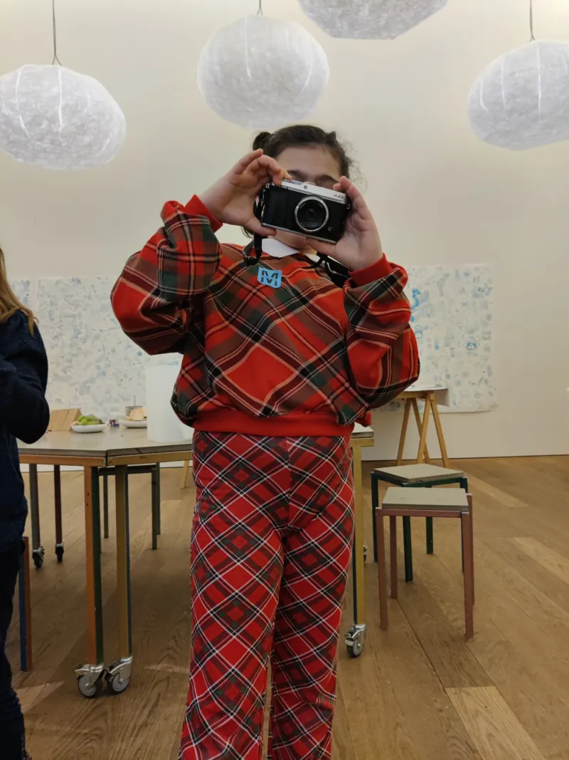 A child participating in a Mudamini photography workshop.