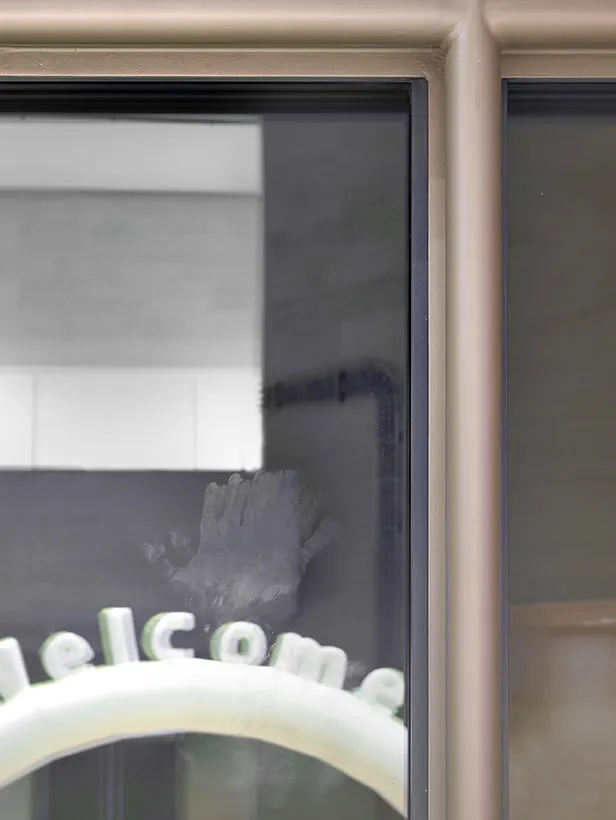 A hand print on one of the windows in the Mudam Grand Hall.