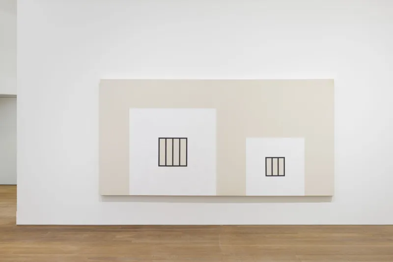 A gray painting with two white squares and black bars on it.