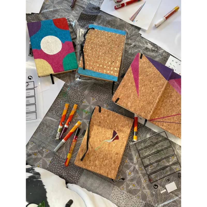Photo of several hand decorated notebooks