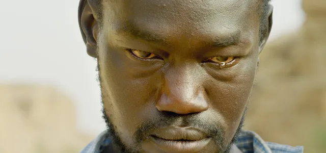 Close-up of an African man crying.