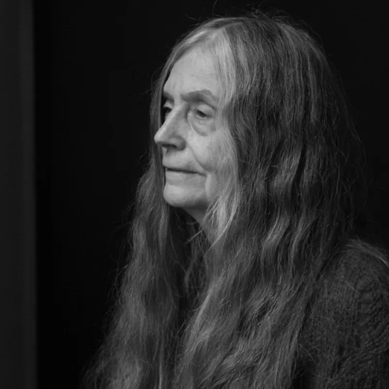 A black and white portrait of Alice Notley.