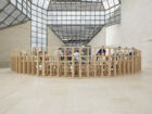 Oscar Murillo, ‘collective conscience’, 2015–ongoing. 30 papier mâché and fabric effigies, wooden bleachers. Courtesy of the artist. View of the exhibition ‘A Model’, Mudam Luxembourg © Photo: Tim Bowditch | Mudam Luxembourg